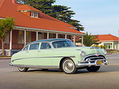 AUT 21 RK2731 01
1953 Hudson Hornet Green 3/4 Front View On Pavement By Buildings
