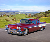 AUT 21 RK2740 01
1958 Pontiac Chieftain Maroon 3/4 Front View On Pavement By Building