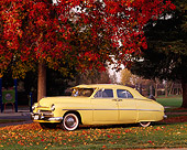 AUT 21 RK0307 01
1950 Yellow Mercury 4-Door Sedan 3/4 Front View On Grass By Autumn Trees