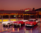 AUT 21 RK0926 02
1955 Pontiac Starchief 1957 Corvette 1955 Chevy Bel Air Front 3/4 View On Wet Pavement Headlights Taxis