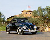 AUT 21 RK1241 03
1951 Volkswagen Hebmuller Convertible Black 3/4 Front View On Pavement By Building And Trees