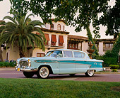 AUT 21 RK1403 02
1957 AMC Nash Ambassador Light Blue Low 3/4 Side View By Building