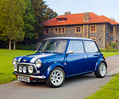 AUT 22 BK0029 01
1965 Mini Blue With Silver Stripes 3/4 Front View On Pavement By Building