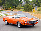 AUT 22 BK0051 01
1969 Pontiac Firebird Convertible Orange 3/4 Front View On Road By House On Hill