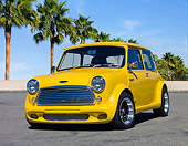 AUT 22 BK0066 01
1961 Austin Mini Cooper Yellow 3/4 Front View On Pavement By Palm Trees