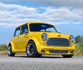 AUT 22 BK0067 01
1961 Austin Mini Cooper Yellow 3/4 Front View On Pavement By Grass