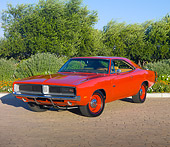 AUT 22 RK2935 01
1969 Dodge Hemi Charger R/T Red 3/4 Front View On Pavement By Trees