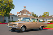 AUT 22 RK2955 01
1965 Plymouth Barracuda Gold 3/4 Front View On Pavement By Building