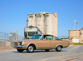 AUT 22 RK2957 01
1965 Plymouth Barracuda Gold 3/4 Front View On Pavement By Building