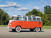 AUT 22 RK3013 01
1960 Volkswagen 23 Window Microbus Orange And White 3/4 Side View On Pavement By Trees