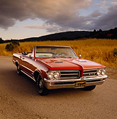 AUT 22 RK0273 01
1964 Pontiac GTO Convertible Red 3/4 Front On Pavement By Dry Grass Field