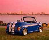 AUT 22 RK1346 02
1966 Austin Mini Cooper Blue White Stripe 3/4 Rear View On Grass By Water