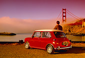 AUT 22 RK1744 06
1967 Austin Mini Cooper S Red And White 3/4 Rear View By Golden Gate Bridge With Man