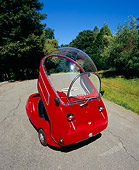 AUT 22 RK1942 03
1964 Peel Trident Microcar Red 3/4 Front View On Pavement By Trees