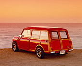 AUT 22 RK2006 01
1962 Austin Mini Traveller Woody Red With White Stripes 3/4 Rear View On Sand By Ocean