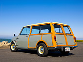 AUT 22 RK2370 01
1965 Morris Mini Minor Traveller Woody Gray 3/4 Low Rear View On Pavement By Water