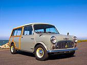 AUT 22 RK2374 01
1965 Morris Mini Minor Traveller Woody Gray 3/4 Low Front View On Pavement By Water