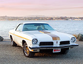 AUT 23 BK0038 01
1973 Oldsmobile Cutlass White And Gold Stripe 3/4 Front View On Gravel By Lake