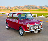 AUT 23 BK0047 01
1975 Morris Mini Cooper Red 3/4 Front View On Pavement By Farm