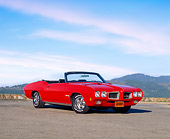AUT 23 RK0339 02
1970 Pontiac GTO Convertible Red 3/4 Side View On Pavement Mountains Blue Sky