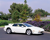AUT 25 RK0410 03
1995 Lotus Esprit S4 White Side 3/4 View On Pavement By Trees