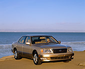AUT 25 RK1029 04
1999 Lexus LS400 Gold 3/4 Front View On Sand By Water Blue Sky