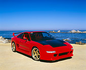 AUT 25 RK1243 02
1991 Toyota MR2 Red Black With Black Hood 3/4 Front View On Sand By Ocean