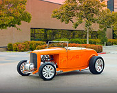 AUT 26 RK2862 01
1932 Ford Hi-Boy Roadster Hot Rod Orange 3/4 Front View On Pavement By Building