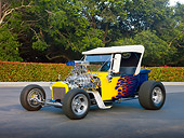 AUT 26 RK3040 01
1923 Ford T-Bucket Hot Rod Blue With Yellow Flames 3/4 Front View On Pavement By Trees