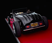 AUT 26 RK0541 09
1929 Ford Track Nose Roadster Black And Cream Rear 3/4 View On Red Floor Studio