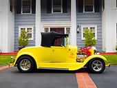 AUT 26 RK1212 01
1929 Ford Hot Rod Yellow Convertible Profile View On Pavement By House