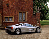 AUT 28 RK0019 03
McLaren F1 Silver 3/4 Rear View Stone Pavement And Brick House