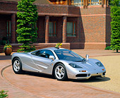 AUT 28 RK0072 05
McLaren F-1 Silver 3/4 Side View On Brick Floor By Building