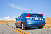 AUT 29 BK0005 01
2010 Honda Insight Blue 3/4 Rear View Driving On Road