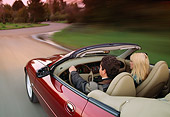 AUT 29 RK0042 03
1997 Jaguar XK8 Convertible Red In Motion On Road With Driver And Passenger
