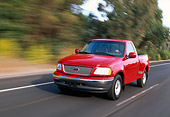 AUT 29 RK0207 04
1999 Ford F150 Lariat Triton V8 Red 3/4 Front View On Road In Motion