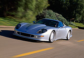 AUT 29 RK0287 10
1998 Chevrolet Callaway C12 Corvette Silver 3/4 Side View On Road In Motion By Trees