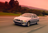 AUT 29 RK0516 01
2000 BMW M5 Light Blue 3/4 Front View On Road In Motion