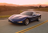 AUT 29 RK0582 01
2002 Chevrolet Corvette Z06 Coupe Blue 3/4 Front View On Road In Motion