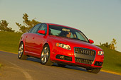 AUT 29 RK0880 01
2006 Audi, A4, 2.0 T, Red Low 3/4 Front View On Road In Motion By Grass Hills