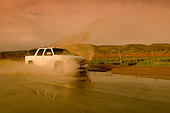 AUT 29 RK1165 01
2005 GMC Yukon XL Denali White 3/4 Front View On Wet Road In Motion