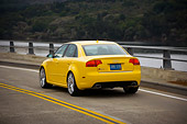 AUT 29 RK1241 01
2007 Audi RS4 Yellow 3/4 Rear View On Road In Motion