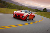 AUT 29 RK1281 01
2007 Pontiac Solstice GXP Convertible Red 3/4 Front View On Road In Motion
