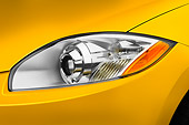 AUT 30 IZ0566 01
2009 Mitsubishi Eclipse GT Coupe Yellow Headlight Detail Studio