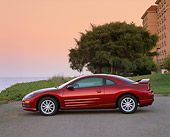 AUT 33 RK0038 02
2000 Mitsubishi Eclipse GT Red Profile View On Pavement By Grass And Tree