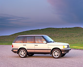 AUT 33 RK0134 02
2000 Range Rover Gold Side View On Pavement Hills