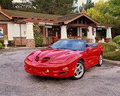 AUT 33 RK0149 12
2000 Pontiac Firebird Trans Am WS6 Convertible Red 3/4 Front View On Pavement By House