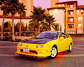 AUT 33 RK0324 02
2000 Acura Integra Type R Yellow 3/4 Front View By Building And Palm Trees Filtered