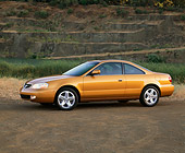 AUT 34 RK0076 01
2001 Acura 3.2CL Gold 3/4 Side View On Dirt By Water Against Rock Mountain