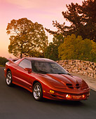 AUT 34 RK0168 02
2001 Pontiac Firebird Trans Am Sunset Orange Slanted Front 3/4 View On Pavement Filtered